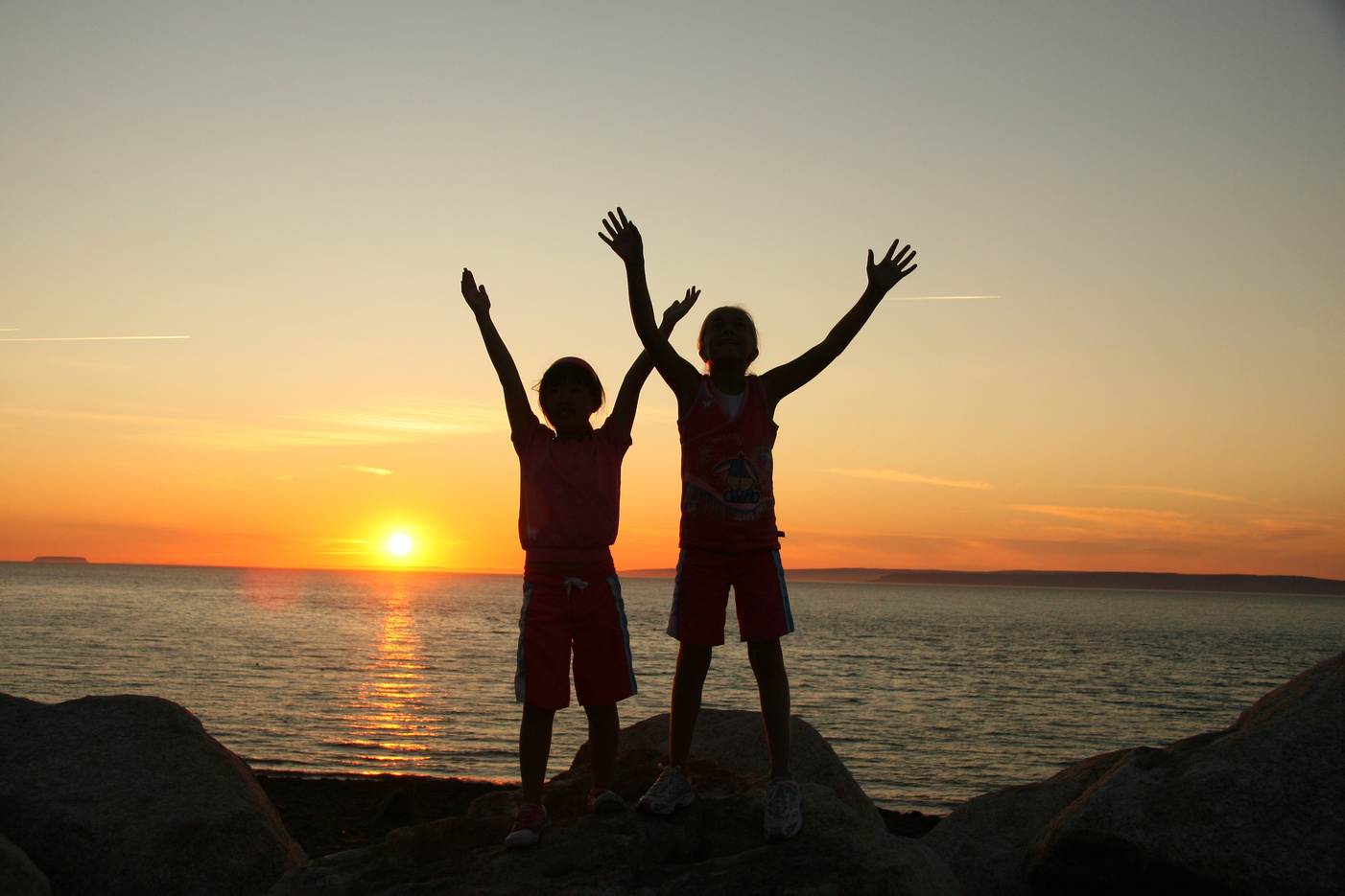 Two Children Silhouette at Sunset